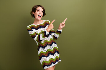 Photo portrait of lovely young lady look excited point empty space dressed stylish print knitted...