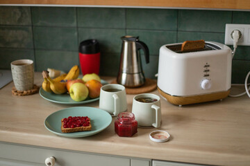 cup of tea and toast on the table in the kitchen