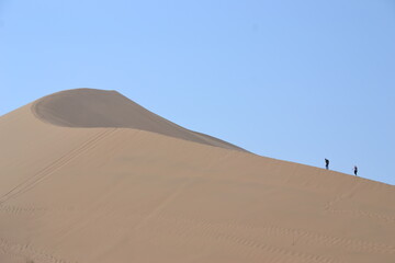 Fototapeta na wymiar people on dune