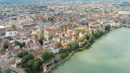 Fototapeta na wymiar Basel, Switzerland. Basel Cathedral. Basel is a city on the Rhine River in northwestern Switzerland, near the borders with France and Germany, Aerial View
