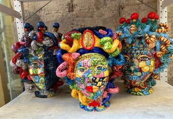 Sicilian Moorish Ceramic Heads vases art of Maiolica. Testa di Moro typical of caltagirone in the Souvenirs shop in Sicily. 