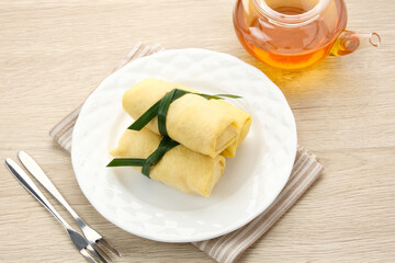Semar Mendem, made from sticky rice with shredded chicken, wrapped in an omelette or crepe. Indonesian traditional food
