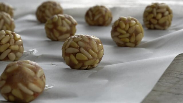 Preparation of panellets of raw pine nuts prepared for baking. Typical snack eaten on the feast of All Saints in Catalonia. 