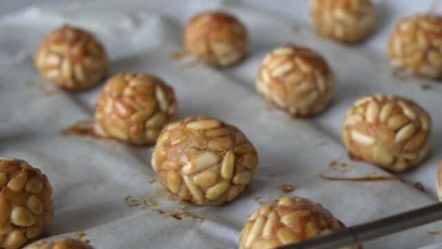 Pine nut panellets fresh from the oven. Typical snack eaten on the feast of All Saints in Catalonia. 