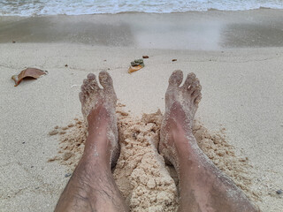 feet on the beach