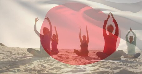 Composite video of waving japan flag against diverse group of people practicing yoga at the beach - Powered by Adobe