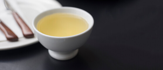 cup of white wine Ribeiro on black table, Galicia, copy space 