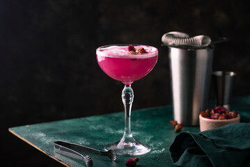 Summer pink cocktail with rose flowers