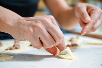 hands making dough