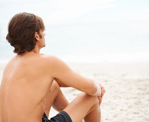 Man, thinking and sitting on beach sand relax for ocean summer air, vacation peace or sunshine travel. Male person, back view and thoughts or calm sea rest or water waves, outdoor or tropical island