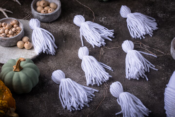 DIY craft Halloween garland in shape of ghost.