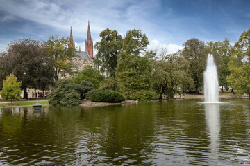 Warmerdamm Park with fountain and lake  of the city of Wiesbaden Germany Hesse.