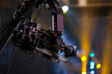 TV camera on a crane at a football match or concert. Close-up live video broadcast camera