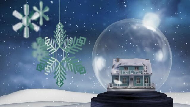 Animation of snow globe and snow falling on blue background