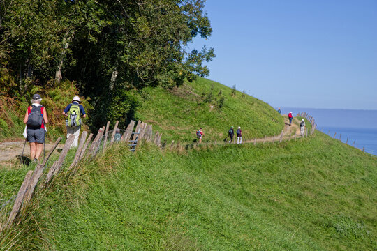 ZUMAIA, SPAIN, September 25, 2023 : Pilgrims on the way to Santiago de Compostella by Camino del Norte (North path) in Basque country.