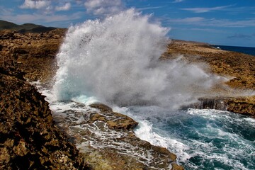 waves crashing on rocks
