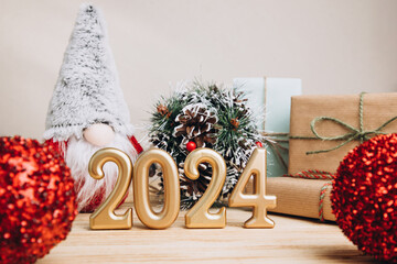 Background for greetings with empty space. Happy new year card. Figures 2024 on a light wooden...