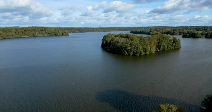 aerial drone flight over the "Gro&szlig;er Eutiner See" in Germany on a cloudy day