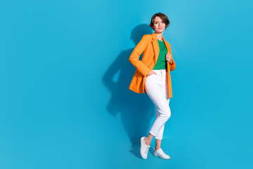 Full size body length photo of charming lady professional management specialist success business trainer isolated on blue color background