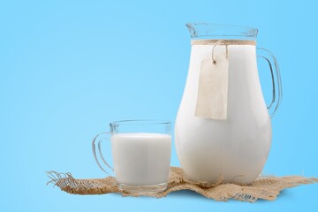 Pouring fresh tasty milk in glass
