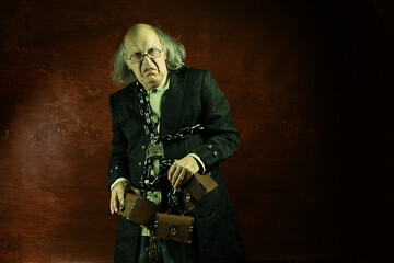Fototapeta na wymiar Ghost of Jacob Marley, Scrooge ex-business partner, chained with a padlock, carrying treasure chests and keys