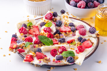 Homemade frozen Yogurt Bark, alternative healthy keto diet ice cream made from greek yogurt, fresh...