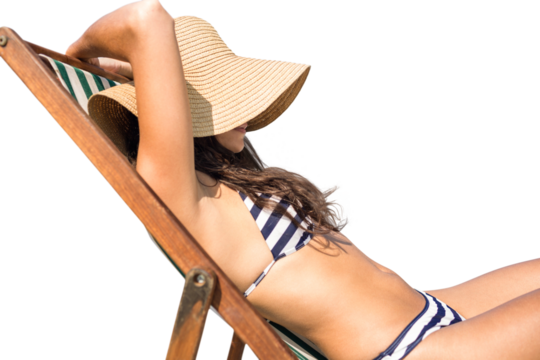 Digital png photo of caucasian woman in bikini lying in sun hat on sun bed on transparent background