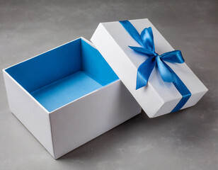 Blank open white gift box with blue bottom inside or opened blue present box with blue ribbon and bow isolated on gray background