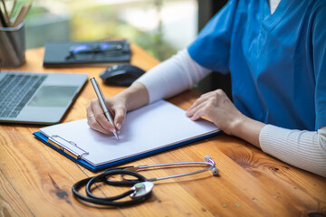 female doctor is reviewing documents to review and diagnose illness and female doctor has determined guidelines for initial treatment when the patient symptoms become more severe. Copy Space for text