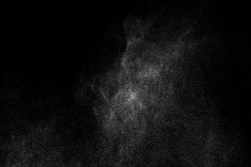 Abstract splashes of water on black background. Freeze motion of white particles. Rain, snow overlay texture.	

