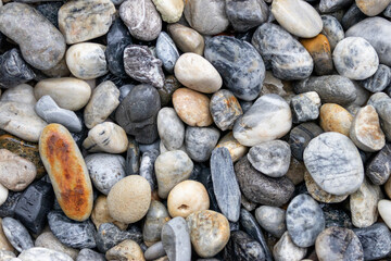 Colorful pebbles on the beach as a background texture composition