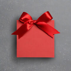 Blank red gift card or gift voucher with red ribbon bow isolated on gray background