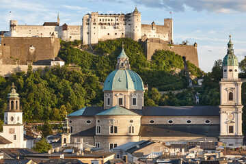 PIcturesque Hohensalzburg fortress and Salzburg cathedral skyline. Salzburg , Austria - obrazy, fototapety, plakaty