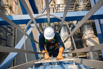 Male climb the stairway storage visual inspection tank