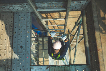 Male climb the stairway storage visual inspection tank