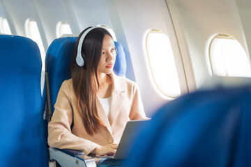 Female airplane passengers, study abroad, asian chinese people, foreign university student passengers preparing for overseas studies. dreams taking flight, global campuses await. english languages