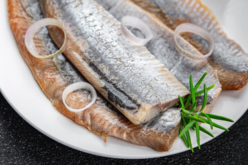 fish salted herring fresh seafood eating cooking meal food snack Pescetarian diet on the table copy space food background rustic top view