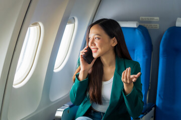 Female airplane passengers asian chinese people Entrepreneurs on Flight, Venturing Overseas Investments. Global Business Expansion, Foreign Markets, Strategic Financial Moves. Women in Business Suits