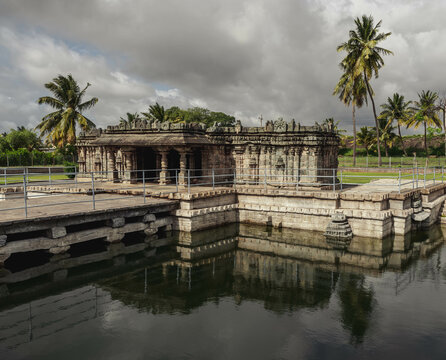 Manikeshwar Temple, Lakkundi. India. Trikuta temple with one of the many historical stepwells at Lakkundi