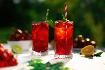 Amazing iced strawberry lemonade drinks. Still life, mojito cocktails for two.