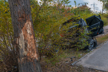 The driver lost control and flew off the road. Serious accident. Black car. The driver was injured....