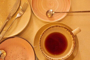 Photo top view of cup and saucer, plates and
