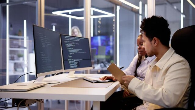 Computer Programmer Writing Program Code On Computer