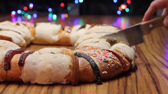 cut the Epiphany cake, Kings cake, Roscon de reyes or Rosca de reyes