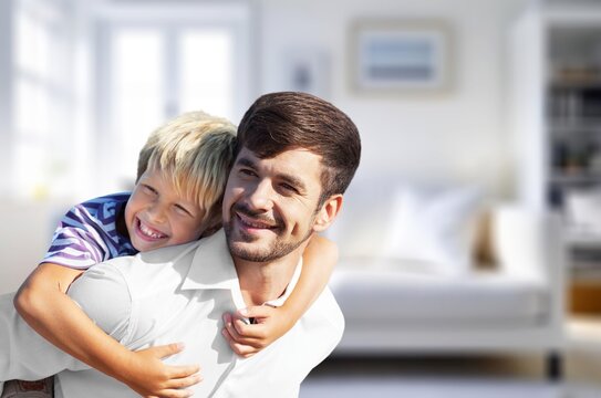 Joyful and happy dad playing with child in the room, AI generated image