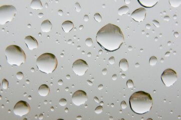 Miniature purity: the delicacy of droplets on glass.