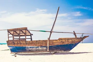 Crédence en verre imprimé Plage de Nungwi, Tanzanie Beautiful Zanzibar coast line. Wooden fisherman boats on sandy beach with blue water background, Zanzibar, Tanzania