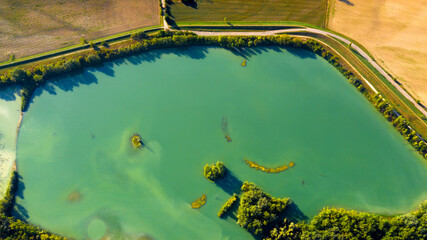 Aerial view of the Secchia River expansion basin oriented nature reserve. It is a protected natural area with small lakes located near Modena, Emilia Romagna, Italy.