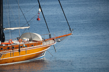 Close up of beautiful wooden sail boat anchored by the coast of Datça, Turkey