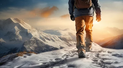 Fototapeten a man in snow boots hiking down a snowy mountain, winter landscape © Uwe